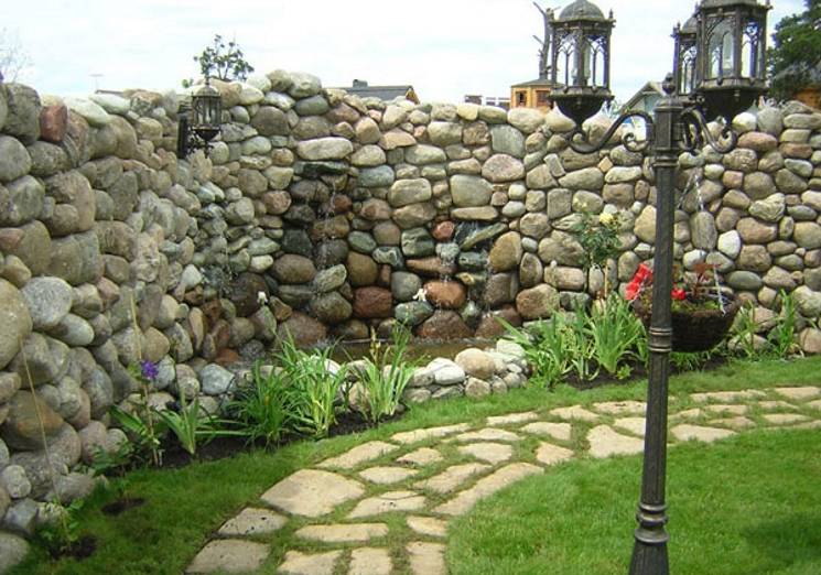Забор из камня: дикого и декоративного, каменная ограда, подготовка элементов